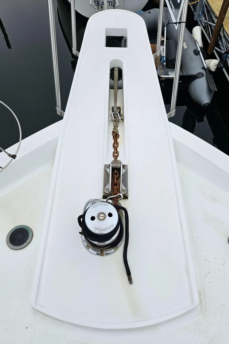 Slide: The Image of 1991 Tollycraft Euro Sport Sedan boat deck with anchor chain and winch. - 5