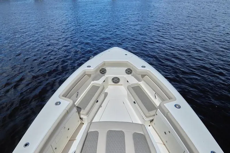 Slide: The Image of 2022 Solace 41 CS boat bow with seating, on calm water. - 14