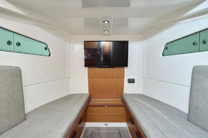 Slide: The Image of Interior of 2022 Solace 41 CS boat with TV and seating. - 18