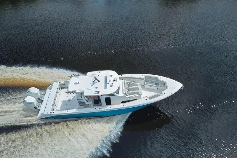 Slide: The Image of 2022 Solace 41 CS boat cruising on open water, aerial view. - 22