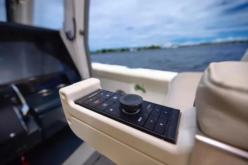 Slide: The Image of Control panel on a 2022 Solace 41 CS boat, overlooking the water. - 29