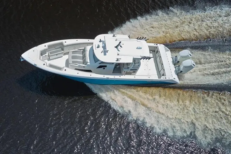 Slide: The Image of Aerial view of 2022 Solace 41 CS boat cruising on water. - 3