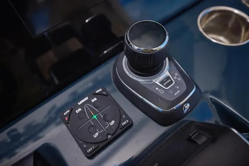 Slide: The Image of Control panel of 2022 Solace 41 CS boat with joystick and trim tab controls. - 30