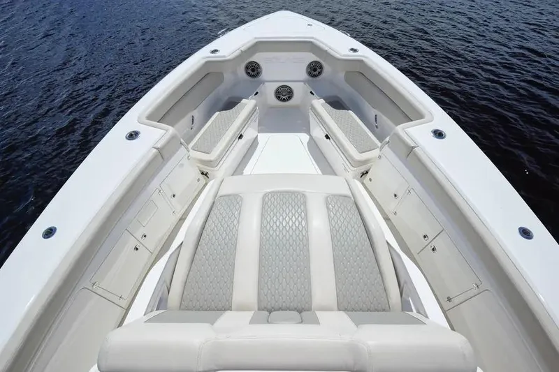 Slide: The Image of 2022 Solace 41 CS boat interior with luxurious seating and speakers on calm water. - 33