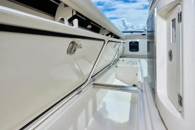 Slide: The Image of 2022 Solace 41 CS boat interior with storage compartments and sleek design. - 35