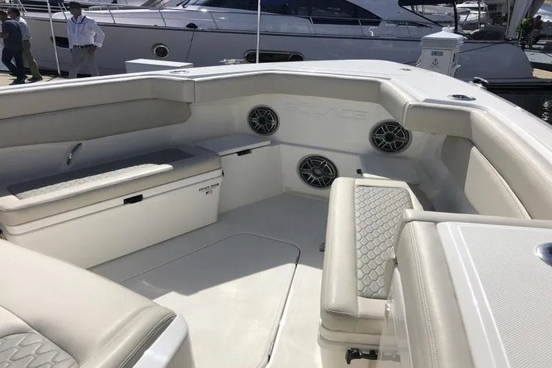 Slide: The Image of Manufacturer Provided Image: 2022 Solace 41 CS boat interior with cushioned seating and built-in speakers. - 6