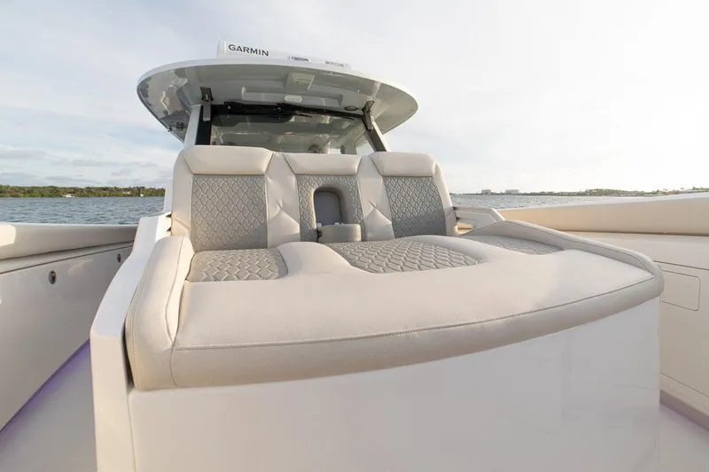 Slide: The Image of Manufacturer Provided Image: 2022 Solace 41 CS boat with luxurious seating on a calm water backdrop. - 7
