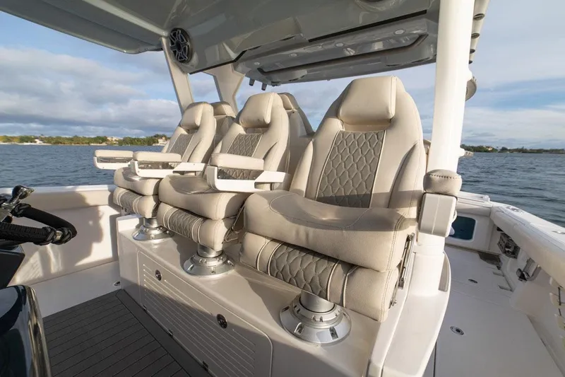 Slide: The Image of Manufacturer Provided Image: Luxurious seating on the 2022 Solace 41 CS boat with ocean backdrop. - 8