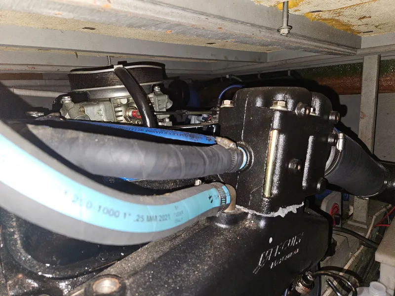 Slide: The Image of Engine compartment of 1978 Tollycraft 37 Sport Sedan with visible hoses and components. - 41
