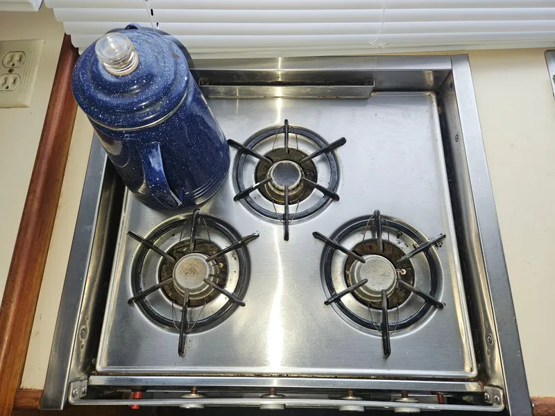 Slide: The Image of Stainless steel stove with blue kettle on Tollycraft 37 Sport Sedan, 1978 model. - 12