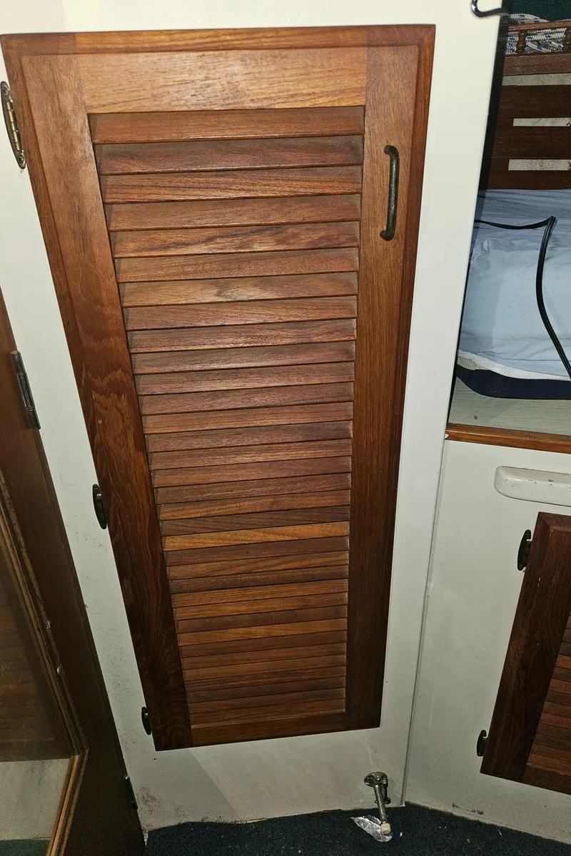 Slide: The Image of Wooden cabinet door inside 1978 Tollycraft 37 Sport Sedan boat interior. - 15