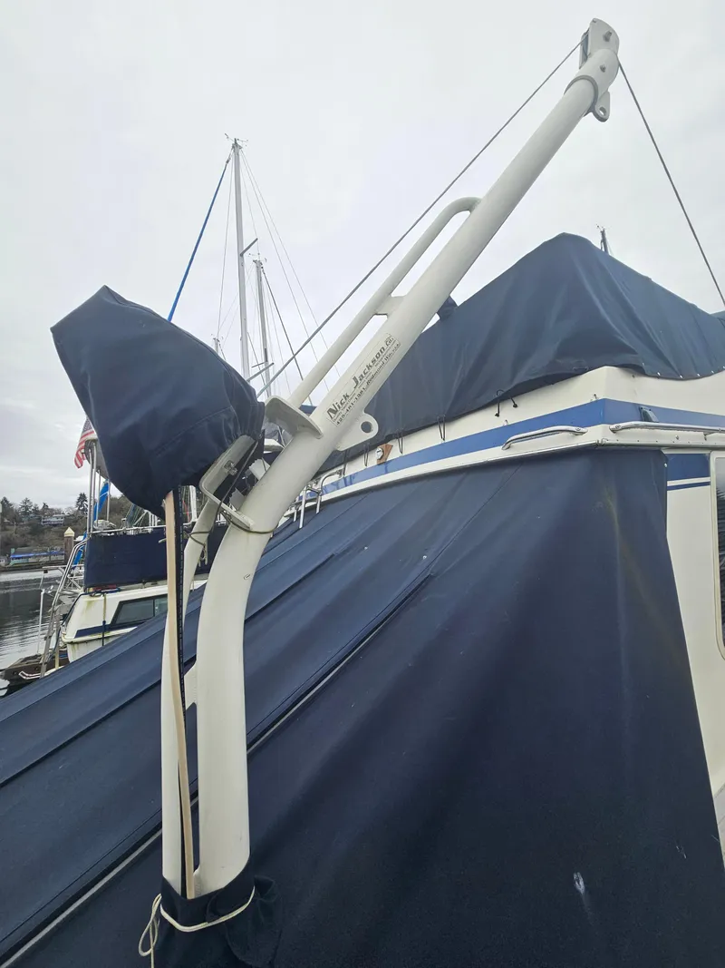 Slide: The Image of 1978 Tollycraft 37 Sport Sedan with blue canvas cover and davit system. - 31