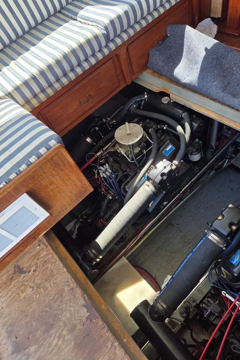 Slide: The Image of Engine compartment of a 1978 Tollycraft 37 Sport Sedan with striped seating. - 35