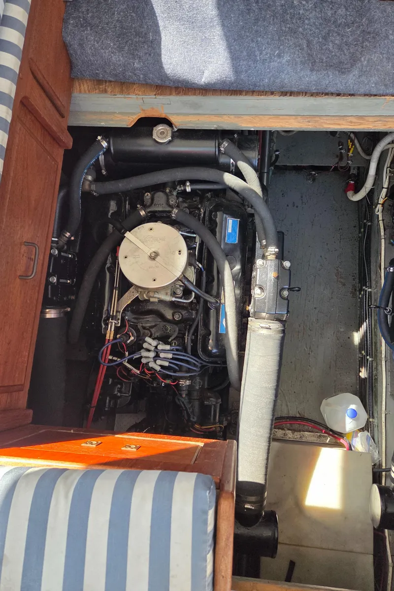 Slide: The Image of Engine compartment of a 1978 Tollycraft 37 Sport Sedan boat, showing mechanical components. - 36
