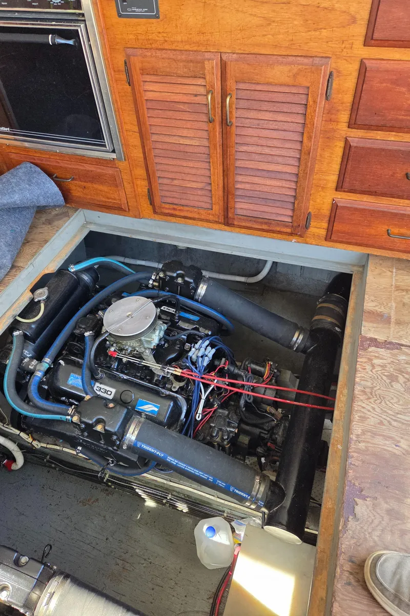 Slide: The Image of Engine compartment of a 1978 Tollycraft 37 Sport Sedan with visible engine components. - 37