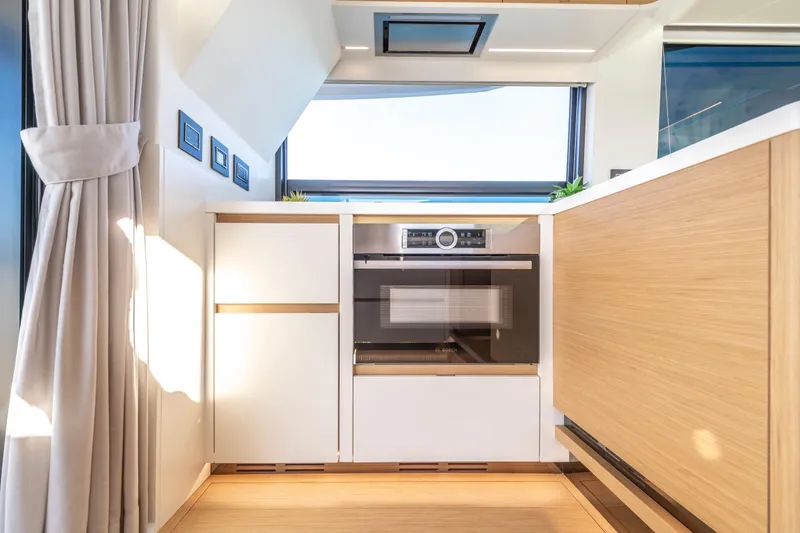 Slide: The Image of Luxurious interior of 2023 Pardo Yachts E60 with modern kitchen and scenic ocean view. - 28