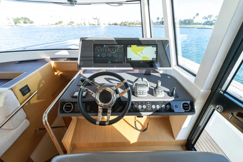 Slide: The Image of 2023 Pardo Yachts E60 interior helm with modern design and panoramic windows. - 34