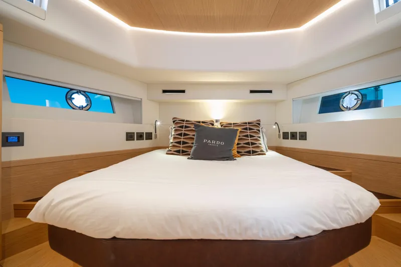 Slide: The Image of Interior of 2023 Pardo Yachts E60, featuring sleek wooden stairs and modern design elements. - 37