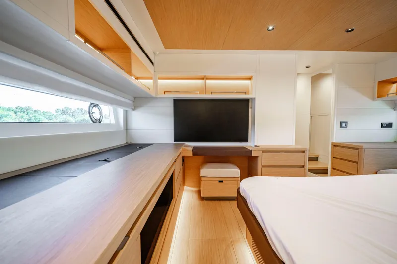Slide: The Image of Luxurious interior of 2023 Pardo Yachts E60, featuring a cozy seating area with elegant wood finishes. - 47