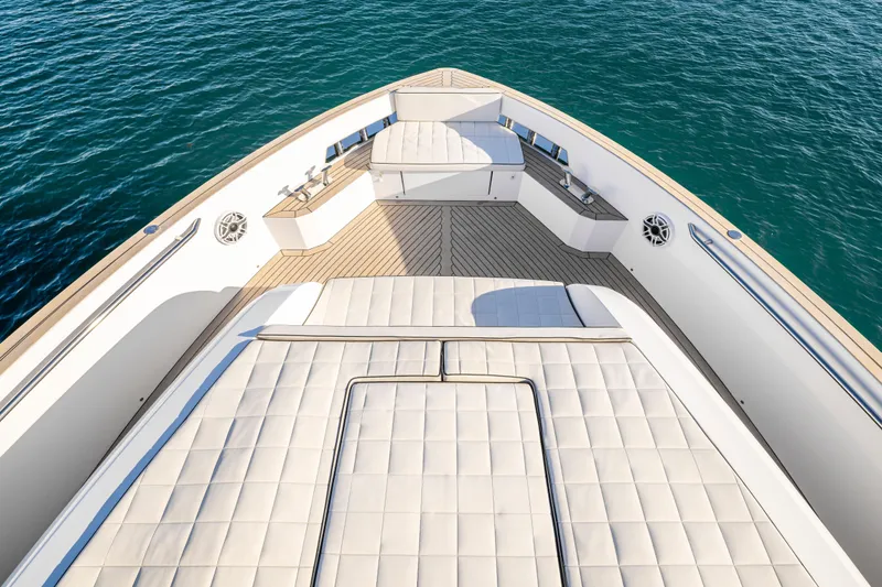 Slide: The Image of 2023 Pardo Yachts E60 luxury yacht on serene water, featuring sleek design and spacious deck. - 54