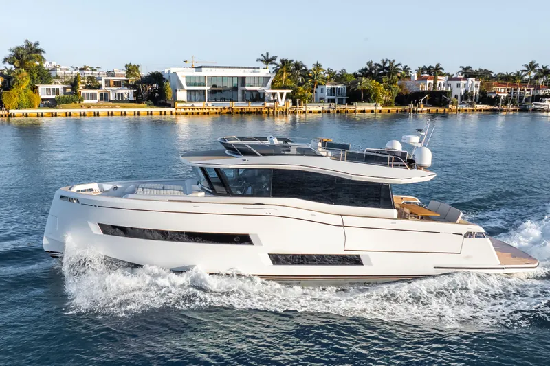 Slide: The Image of 2023 Pardo Yachts E60 deck with luxurious seating and scenic waterfront view. - 60