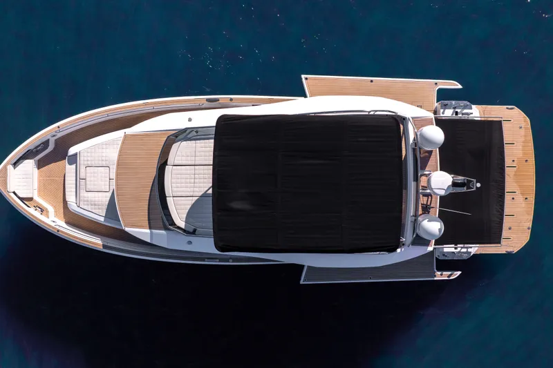 Slide: The Image of Top view of 2023 Pardo Yachts E60 luxury yacht on blue water. - 66