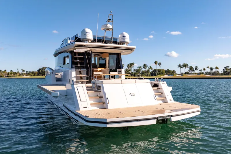 Slide: The Image of Top view of 2023 Pardo Yachts E60 luxury yacht on blue water. - 8