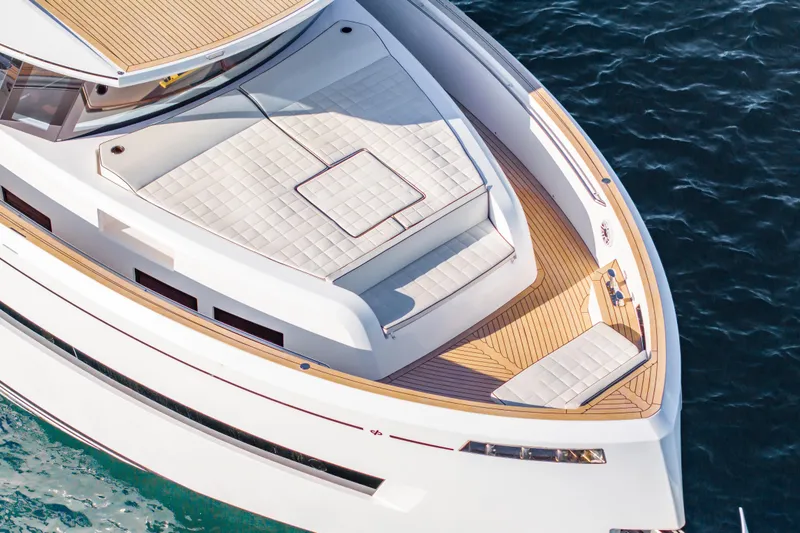 Slide: The Image of 2023 Pardo Yachts E60 luxury yacht on serene water with clear blue sky. - 9