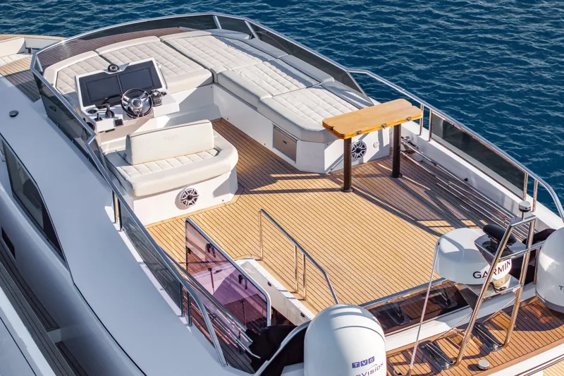 Slide: The Image of 2023 Pardo Yachts E60 luxury yacht on calm water, featuring sleek design and spacious deck. - 11