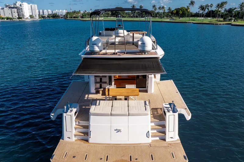 Slide: The Image of Luxurious 2023 Pardo Yachts E60 deck with seating and navigation equipment. - 12