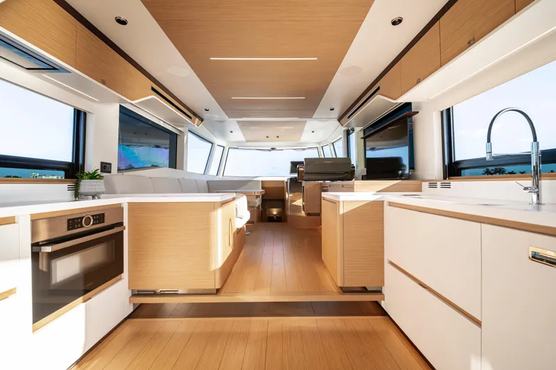 Slide: The Image of Luxurious interior of 2023 Pardo Yachts E60 with modern kitchen and scenic water view. - 26