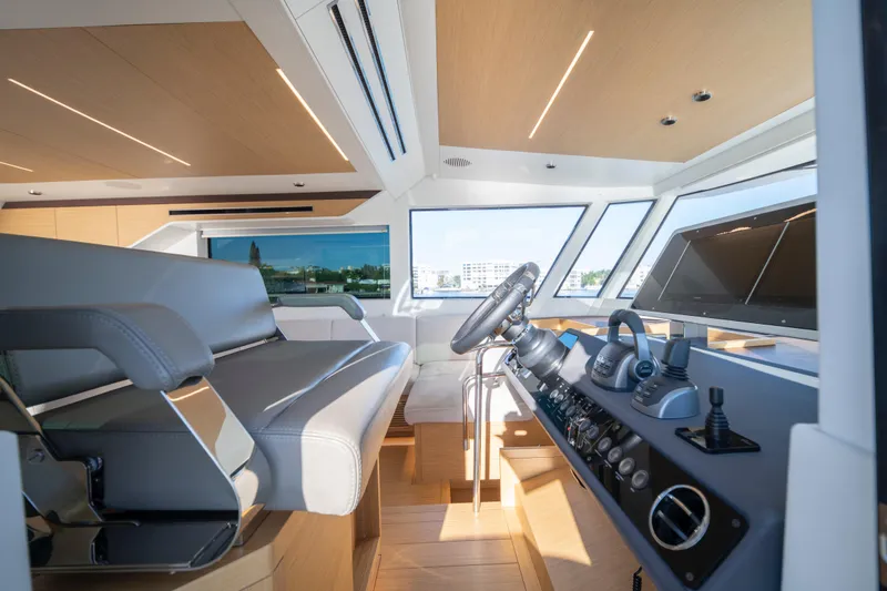 Slide: The Image of Helm of 2023 Pardo Yachts E60 with modern navigation controls and display. - 35