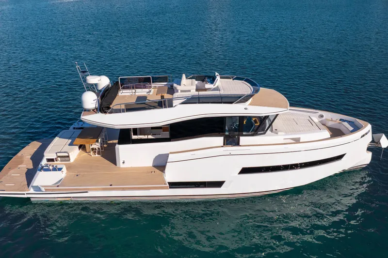 Slide: The Image of 2023 Pardo Yachts E60 cruising on open water, showcasing sleek design and luxury features. - 4