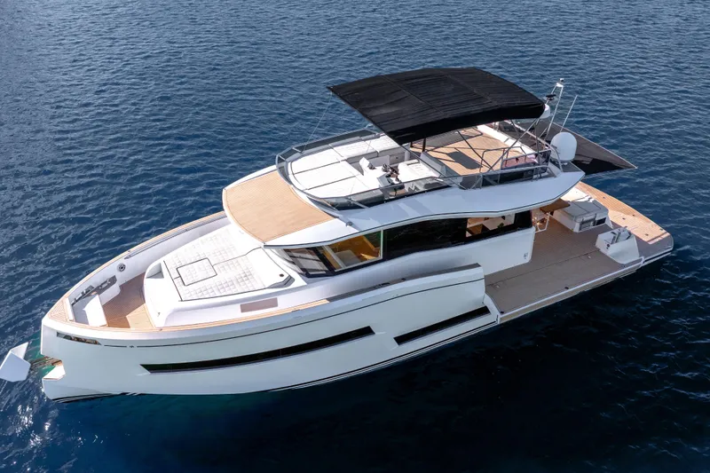 Slide: The Image of 2023 Pardo Yachts E60 luxury yacht on calm blue water, aerial view. - 62