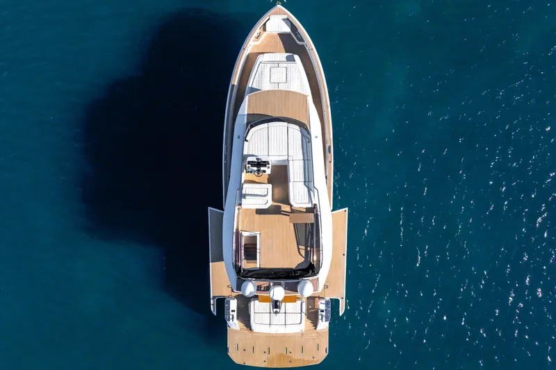 Slide: The Image of 2023 Pardo Yachts E60 luxury yacht on calm blue water, showcasing sleek design. - 63