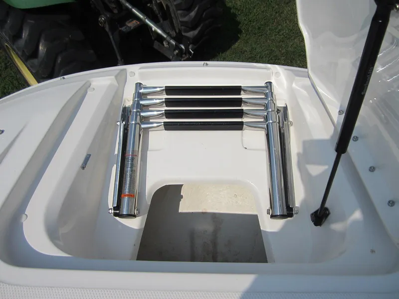 Slide: The Image of Folded swim ladder on a 2012 Sea Ray 240 Sundeck boat. - 13