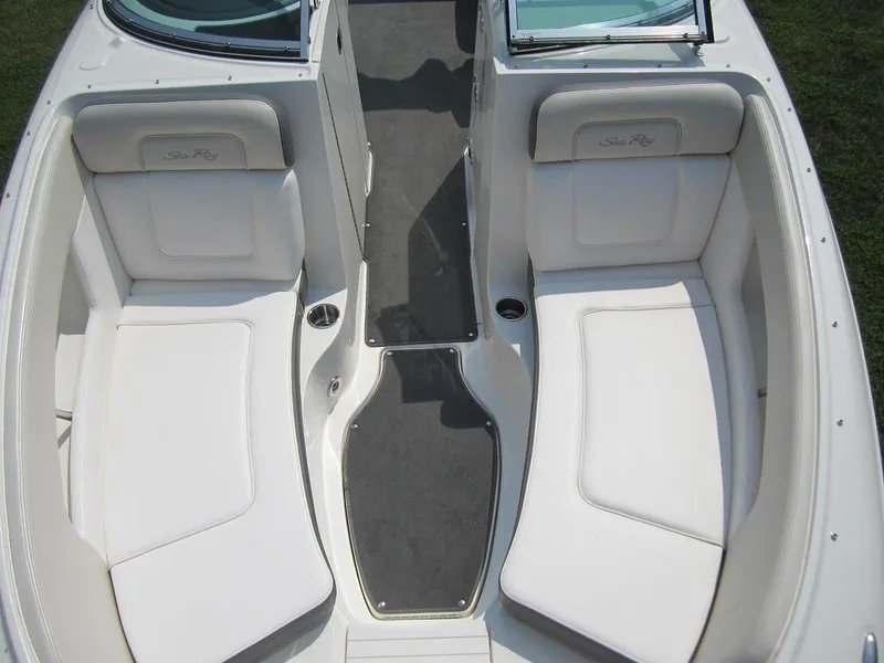Slide: The Image of Interior of a 2012 Sea Ray 240 Sundeck boat with white seating. - 16