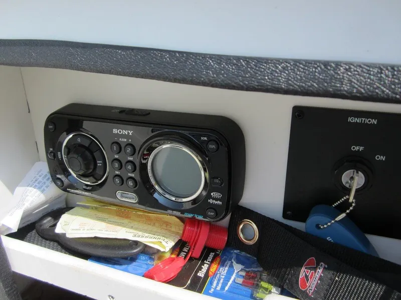 Slide: The Image of Sony stereo and ignition key on 2012 Sea Ray 240 Sundeck. - 18