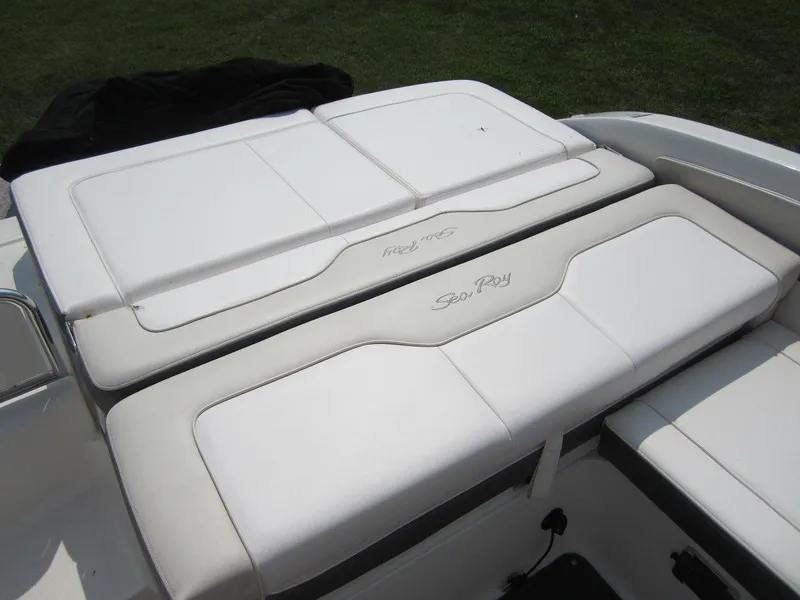 Slide: The Image of 2012 Sea Ray 240 Sundeck seating area, white upholstery. - 22
