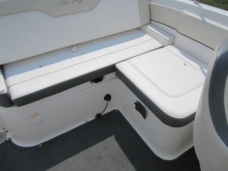Slide: The Image of Interior of 2012 Sea Ray 240 Sundeck with white seating. - 25