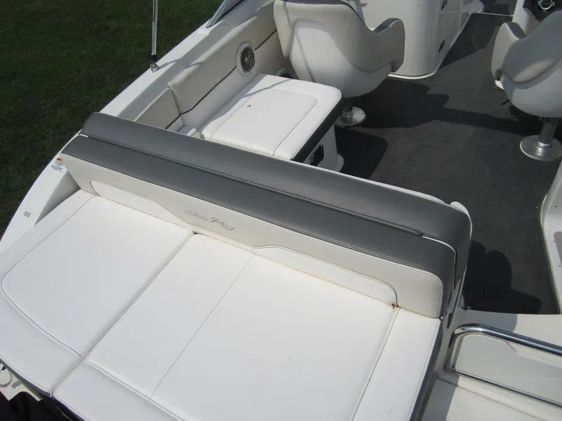 Slide: The Image of Interior of a 2012 Sea Ray 240 Sundeck with white seating. - 27