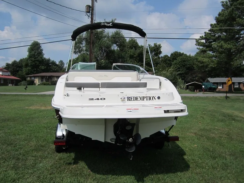 Slide: The Image of Rear view of a 2012 Sea Ray 240 Sundeck boat on grass. - 3