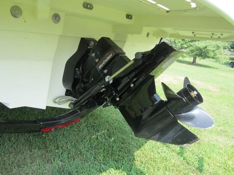Slide: The Image of 2012 Sea Ray 240 Sundeck outboard motor on grass. - 32