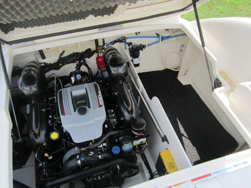 Slide: The Image of Engine compartment of a 2012 Sea Ray 240 Sundeck boat. - 34