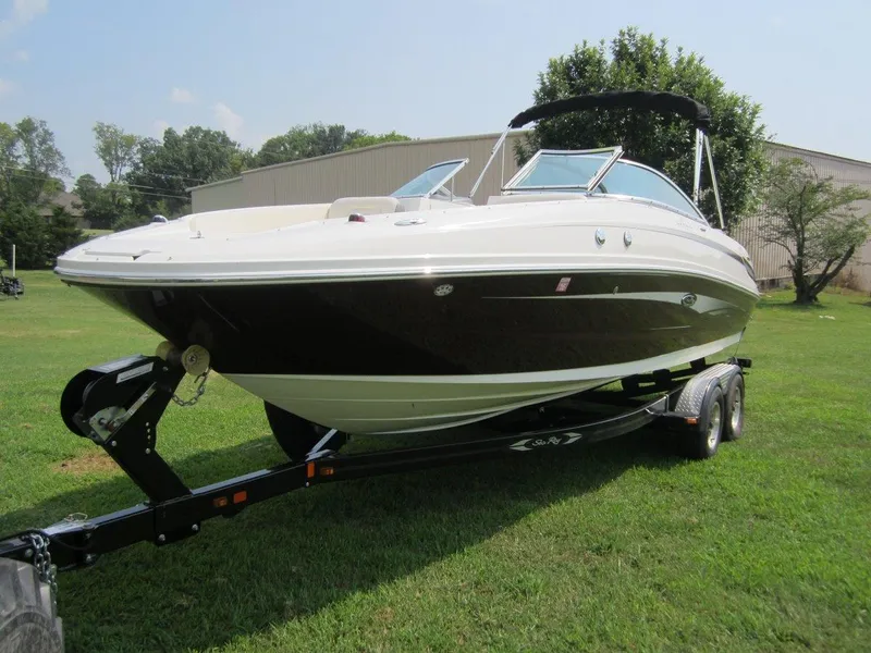 Slide: The Image of 2012 Sea Ray 240 Sundeck on trailer outdoors. - 8