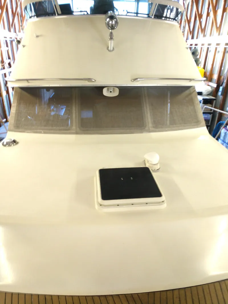 Slide: The Image of 1981 Tollycraft 43 Motoryacht front view with windows and deck details. - 46