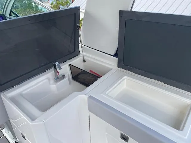 Slide: The Image of Aviara AV 32-OB 2022 boat interior with open storage compartments. - 22