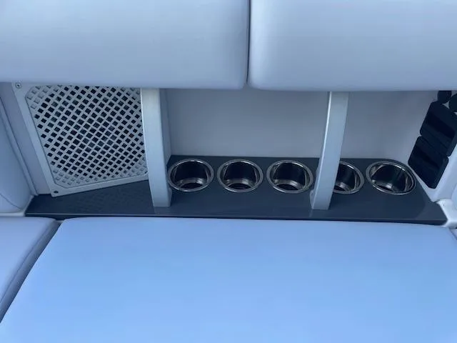 Slide: The Image of Aviara AV 32-OB 2022 boat interior with cup holders and speaker. - 25