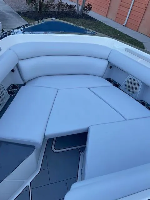 Slide: The Image of 2022 Aviara AV 32-OB boat interior with white cushioned seating. - 27