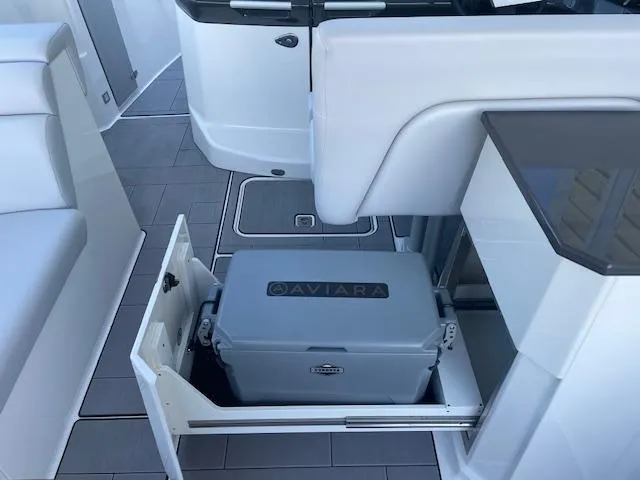 Slide: The Image of 2022 Aviara AV 32-OB boat interior with pull-out cooler storage. - 24
